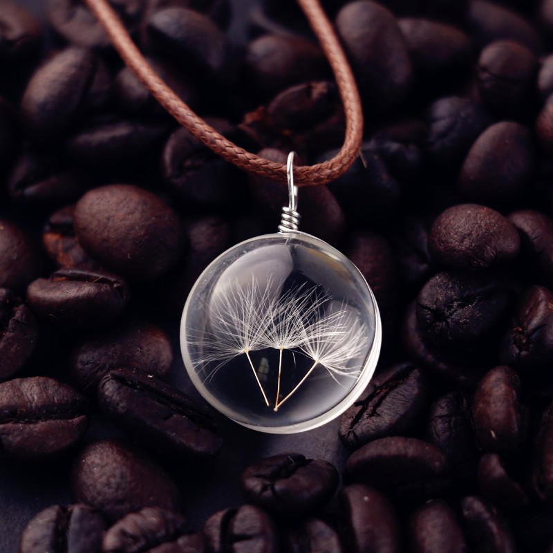 Glass ball necklace containing real dandelion seeds