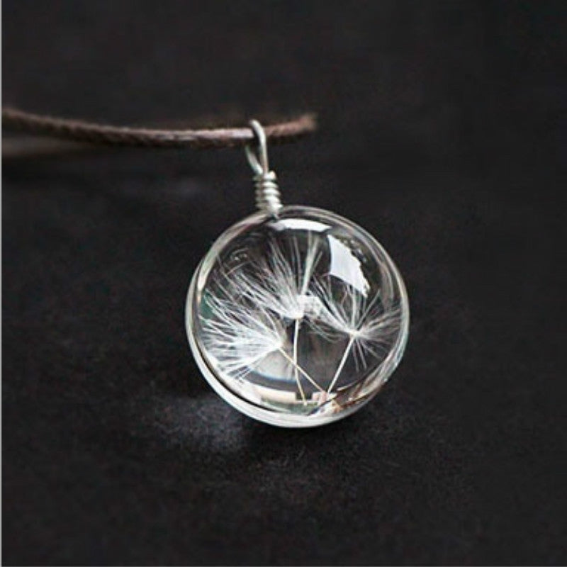 Glass ball necklace containing real dandelion seeds