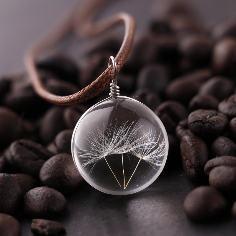 Glass ball necklace containing real dandelion seeds